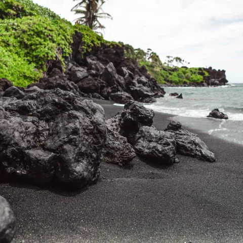 Black Sand lava rock lush green pacific ocean Hana Highway