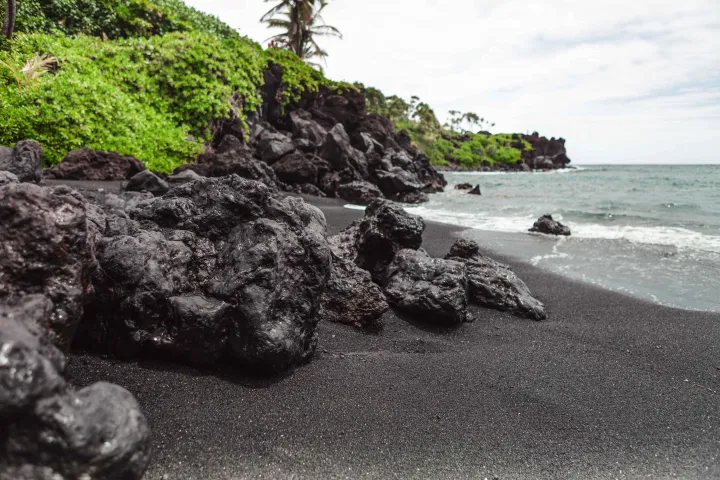 Black Sand lava rock lush green pacific ocean Hana Highway