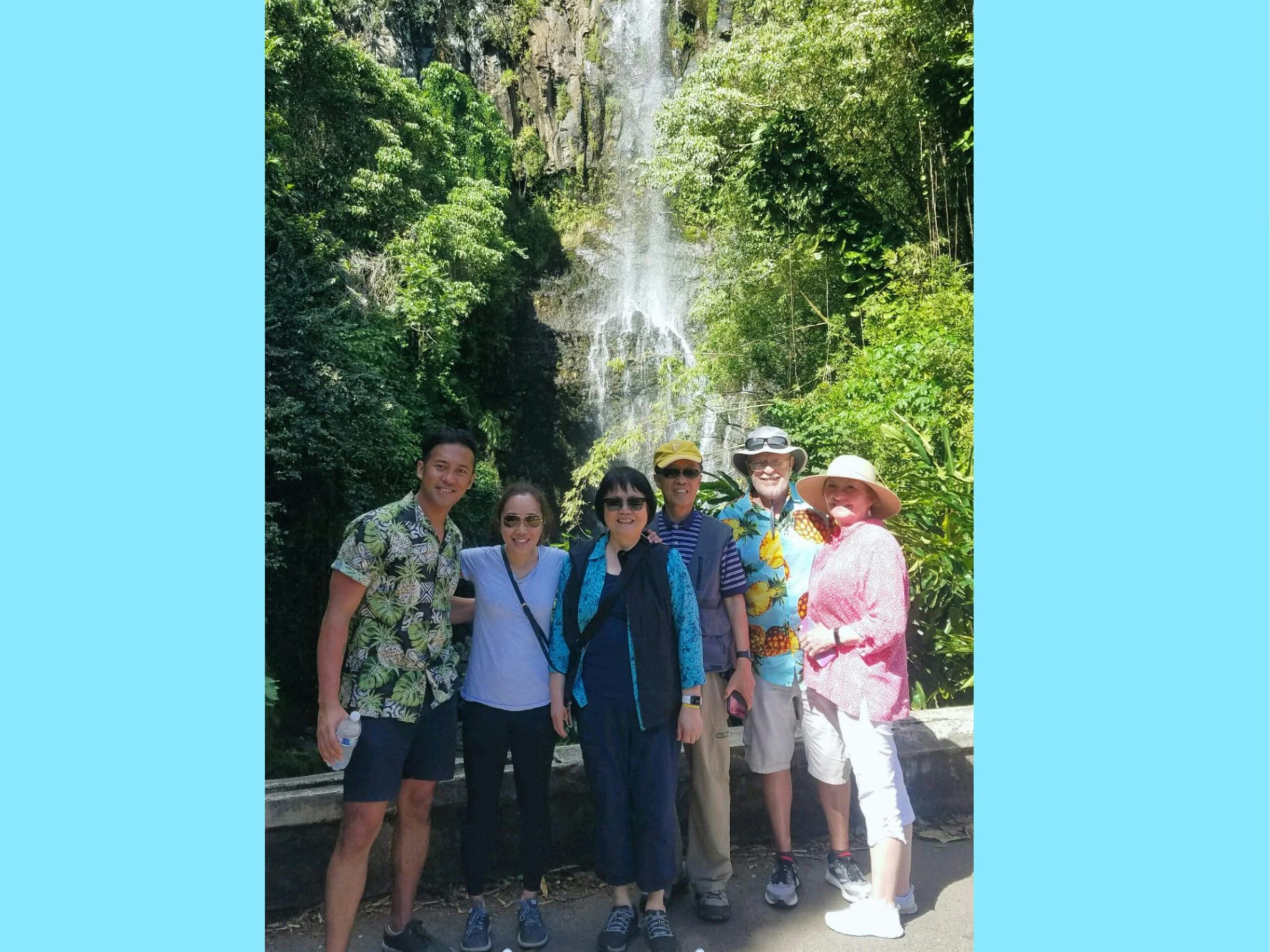 a group of people standing next to a tree
