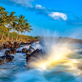 a large waterfall over a body of water