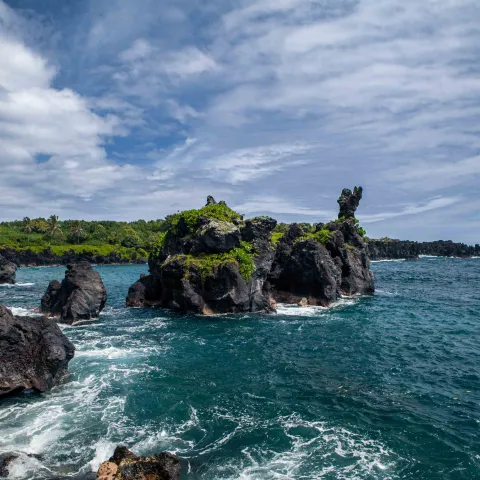 Lava cliffs at Waianapanapa Black Sand Beach Maui